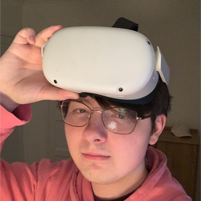 Taylor Whitewood with a Quest 2 VR Headset on their head